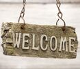 Old wooden welcome sign